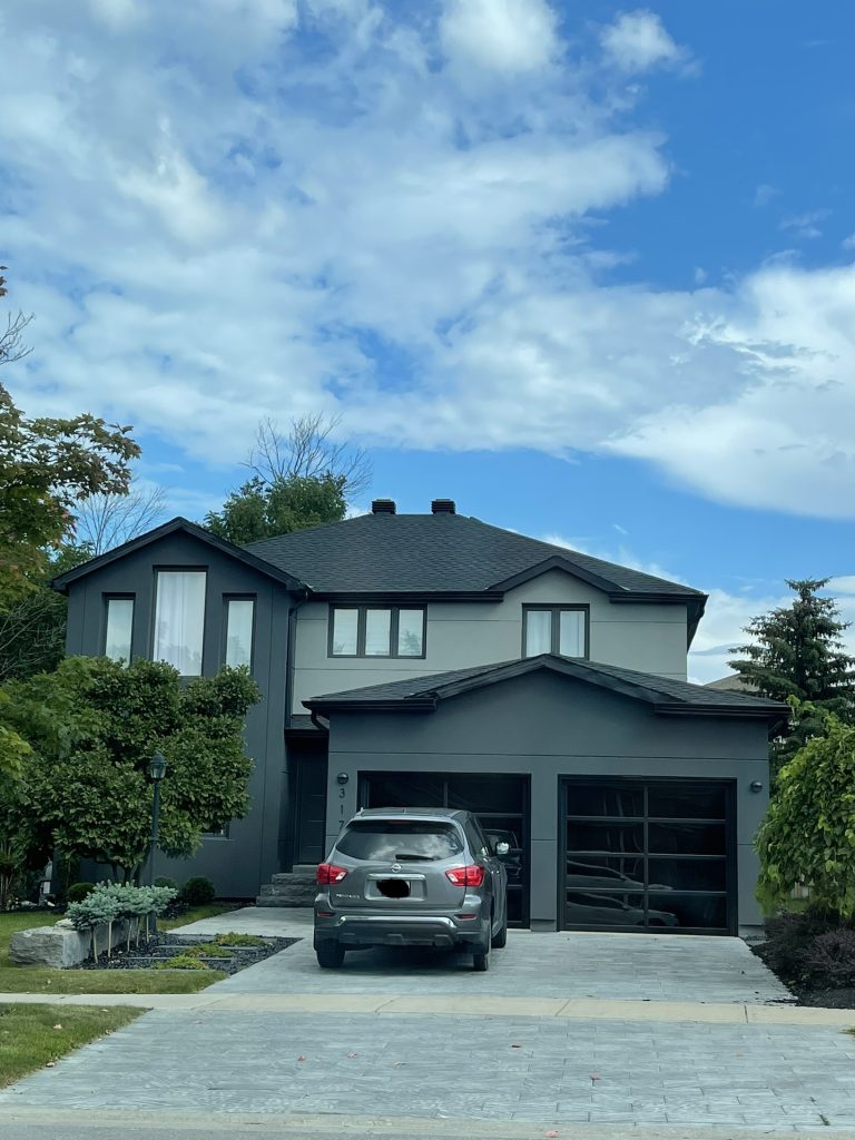 A car parked in front of a house.