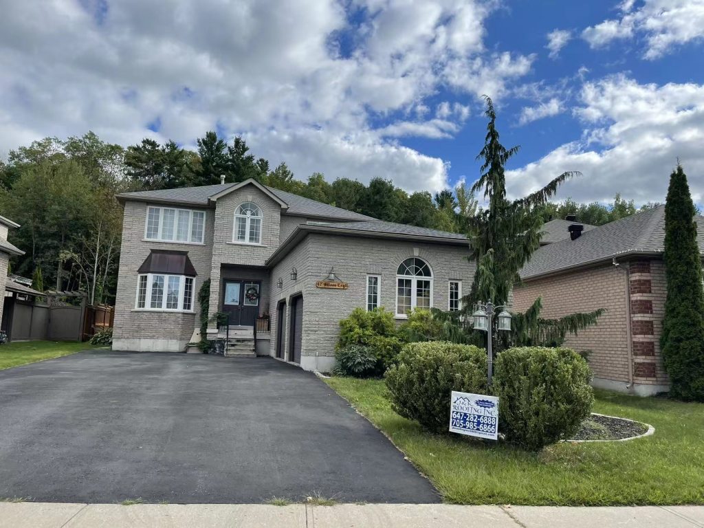 A large house with a sign in front of it