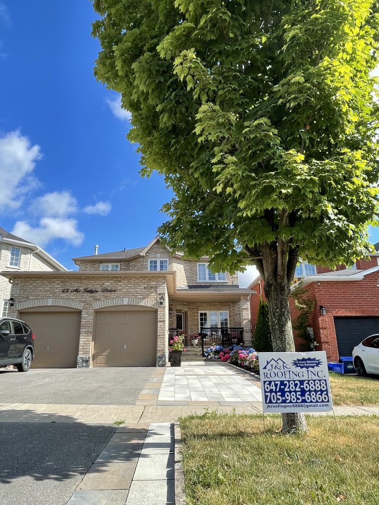 A house with a tree in front of it